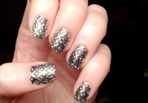 First, I stamped my nails with plate BM-203. Then I filled in the lines with metallic striping tape.